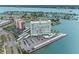Aerial view of a waterfront condo with parking, pool, boat slips, and surrounding waterfront at 31 Island Way # 1507, Clearwater Beach, FL 33767