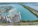 Aerial view of a waterfront condo with parking, boat slips, and beautiful water views at 31 Island Way # 1507, Clearwater Beach, FL 33767