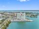 Aerial view of condo building, showing the large parking lot and water surrounding the building at 31 Island Way # 1507, Clearwater Beach, FL 33767