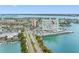 Aerial view of a high-rise building on the water, showcasing its proximity to the bay and surrounding cityscape at 31 Island Way # 1507, Clearwater Beach, FL 33767
