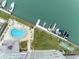 An aerial view of a building, pool, docks, and boats by the water at 31 Island Way # 1507, Clearwater Beach, FL 33767