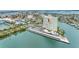 Stunning aerial view of waterfront condo building with marina and covered parking at 31 Island Way # 1507, Clearwater Beach, FL 33767
