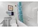 Well-lit bathroom showcasing a jacuzzi tub with a shower, a toilet, and a white vanity at 31 Island Way # 1507, Clearwater Beach, FL 33767