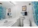 Functional bathroom featuring a sink, toilet, mirror, and a bathtub with a shower curtain at 31 Island Way # 1507, Clearwater Beach, FL 33767