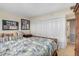 Bedroom view features a cozy wicker bed with large windows, adjacent to a spacious closet with folding doors at 31 Island Way # 1507, Clearwater Beach, FL 33767