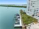 Exterior shot of waterfront condo with boat dock, green space, and lounge area at 31 Island Way # 1507, Clearwater Beach, FL 33767