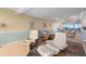 Spacious living room featuring plush seating, a decorative rug, and an open dining area with water views at 31 Island Way # 1507, Clearwater Beach, FL 33767
