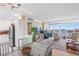 Open living space with dining area, waterfront views, and modern furnishings at 31 Island Way # 1507, Clearwater Beach, FL 33767