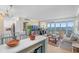Open concept living and kitchen area with floor to ceiling windows and water views at 31 Island Way # 1507, Clearwater Beach, FL 33767