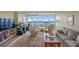 Living room featuring floor to ceiling windows with city skyline views and comfortable seating at 31 Island Way # 1507, Clearwater Beach, FL 33767