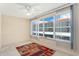 Bright bedroom featuring a ceiling fan and large windows providing natural light at 3128 59Th S St # 206, Gulfport, FL 33707