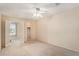Spacious bedroom with a ceiling fan, closet access, and a window view of the community at 3128 59Th S St # 206, Gulfport, FL 33707