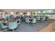 Inviting common room with tables, chairs, and a mural, perfect for community gatherings and relaxation at 3128 59Th S St # 206, Gulfport, FL 33707