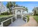 Inviting gazebo overlooking the water, surrounded by lush greenery and palm trees at 3128 59Th S St # 206, Gulfport, FL 33707