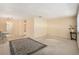Open living space featuring plush carpeting, elegant chandelier, with view to the kitchen and dining areas at 3128 59Th S St # 206, Gulfport, FL 33707