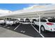 Covered parking area with designated spaces, offering convenient and protected parking for residents at 3128 59Th S St # 206, Gulfport, FL 33707