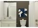 Modern bathroom featuring white subway tile, white vanity with marble countertop, and dark accent wall at 31781 Griffin Sands Ln, San Antonio, FL 33576
