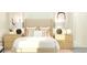 Bright bedroom with a plush bed, side tables, lamps, and decorative pillows at 32078 Griffin Sands Ln, San Antonio, FL 33576