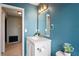 Charming bathroom with a modern vanity and updated lighting fixtures at 3353 Montano Ave, Spring Hill, FL 34609