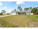 Attractive single-story home featuring an attached garage, a driveway, and verdant front lawn at 3353 Montano Ave, Spring Hill, FL 34609