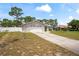 Well-kept single-story home showcasing an attached garage, driveway, and green front lawn at 3353 Montano Ave, Spring Hill, FL 34609