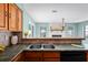 This kitchen has a double basin sink and breakfast bar, offering a practical layout for cooking and entertaining at 3353 Montano Ave, Spring Hill, FL 34609