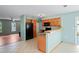 Inviting kitchen with a breakfast bar that connects to an adjacent room creating an open and airy living space at 3353 Montano Ave, Spring Hill, FL 34609
