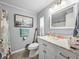 Bathroom featuring a white vanity, a toilet, and an artwork of the Eiffel Tower at 35051 Colony Hills Dr, Zephyrhills, FL 33541