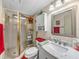 Bathroom featuring a toilet, shower, vanity, cabinet, and towel rack at 35051 Colony Hills Dr, Zephyrhills, FL 33541