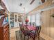 Charming dining room with a chandelier, an elegant table set, and built-in display cabinet at 35051 Colony Hills Dr, Zephyrhills, FL 33541