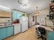 Functional kitchen with a refrigerator, a dining table and a view into the dining room at 35051 Colony Hills Dr, Zephyrhills, FL 33541