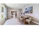 Bright dining area with modern decor, stylish furniture and a large window offering natural light at 35895 Sunflower Hill Dr, Zephyrhills, FL 33541