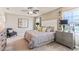 This bedroom features neutral walls, ceiling fan, carpeted floors, and windows for natural light at 36093 Sunflower Hill Dr, Zephyrhills, FL 33541