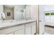 Bathroom featuring a double sink vanity with modern fixtures and a spacious shower at 36131 Sunflower Hill Dr, Zephyrhills, FL 33541
