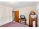 Bedroom with a closet, a door leading to an adjacent space, and a wooden cabinet at 403 Westbrook Ave, Brandon, FL 33511