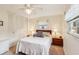 Bright bedroom with a ceiling fan, built in closet, and windows with natural light at 403 Westbrook Ave, Brandon, FL 33511