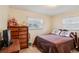 Inviting bedroom featuring a bed, dresser, and natural light from the windows at 403 Westbrook Ave, Brandon, FL 33511