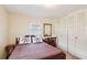 Bright bedroom with a comfortable bed, closet, and a traditional style mirror at 403 Westbrook Ave, Brandon, FL 33511