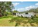 Exterior view of backyard with lawn and landscaping at 403 Westbrook Ave, Brandon, FL 33511