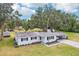 Exterior view of home and backyard showing trees and yard at 403 Westbrook Ave, Brandon, FL 33511