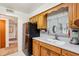 Functional kitchen with stainless steel refrigerator, double sink, and white countertops at 403 Westbrook Ave, Brandon, FL 33511
