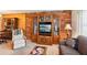 Cozy living room featuring a brick accent wall, and classic furnishings, providing a comfortable and inviting space at 403 Westbrook Ave, Brandon, FL 33511