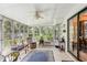 Sun Room featuring tile flooring and many windows overlooking the backyard at 403 Westbrook Ave, Brandon, FL 33511
