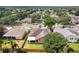 Residential street view showing well-kept lawns, screened patios and typical neighborhood streetscape at 4511 Swift Cir, Valrico, FL 33596