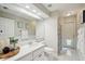 Bathroom featuring a vanity and toilet, with access to a shower and exterior at 4511 Swift Cir, Valrico, FL 33596