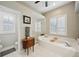 Bright bathroom features a large soaking tub, vanity, and separate glass shower at 4511 Swift Cir, Valrico, FL 33596