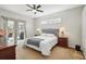 Bright bedroom with neutral décor, sliding glass door to patio, and comfortable carpet at 4511 Swift Cir, Valrico, FL 33596