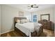 Comfortable bedroom with a ceiling fan, natural light, and ample closet space at 4511 Swift Cir, Valrico, FL 33596