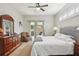 Inviting bedroom with a comfortable bed, neutral décor, and access to the screened in patio at 4511 Swift Cir, Valrico, FL 33596