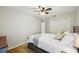 Inviting bedroom featuring a ceiling fan, neutral walls, and cozy carpeting at 4511 Swift Cir, Valrico, FL 33596